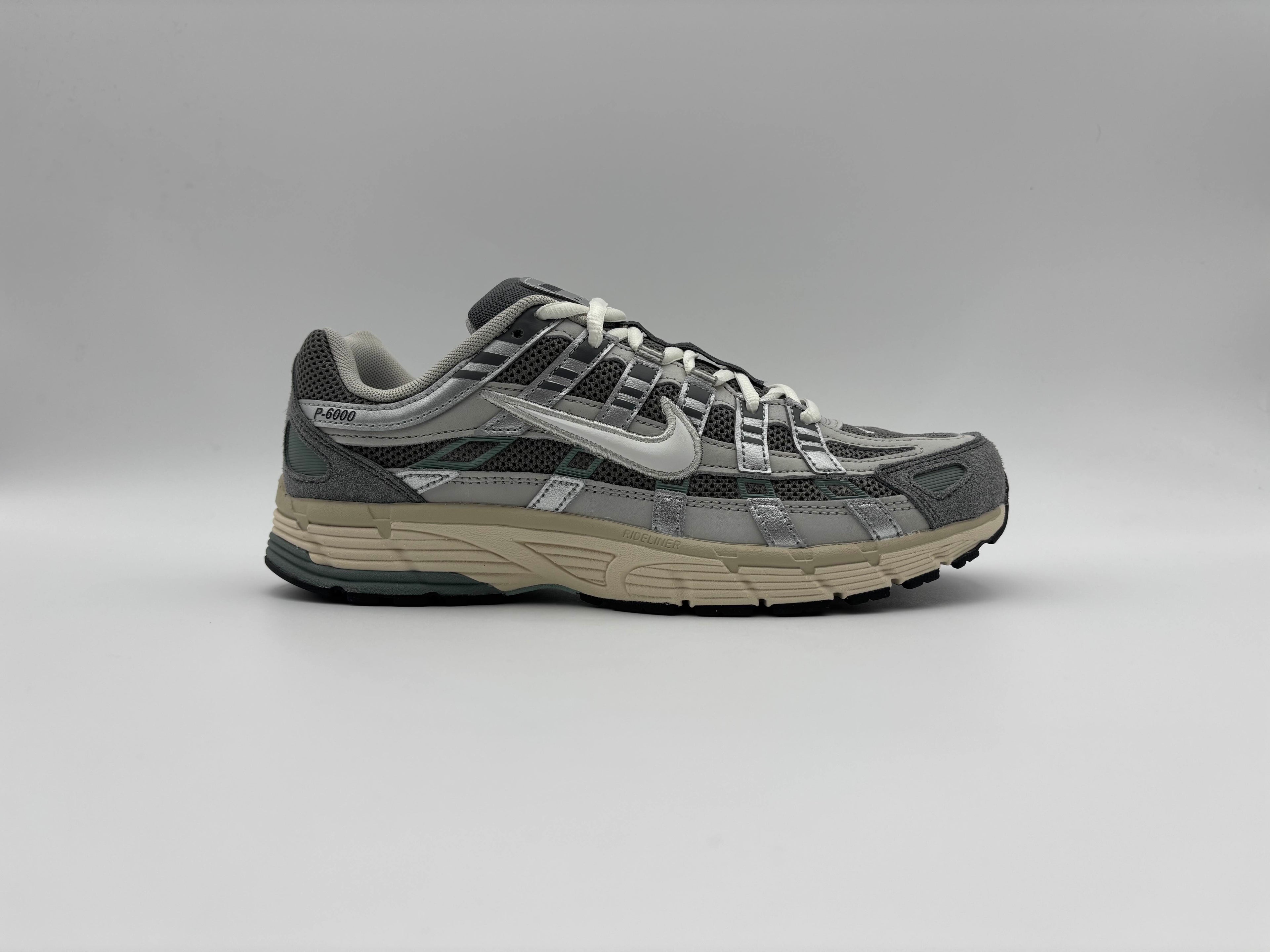 Side view of Nike P-6000 Flat Pewter sneakers with retro running-inspired design, breathable mesh and synthetic upper, and cushioned rubber sole for comfort and everyday streetwear style