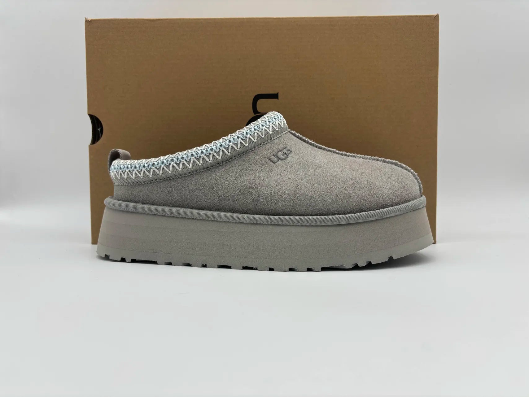 Side view of UGG Tazz Slipper Campfire with cozy suede upper, plush wool lining, and durable rubber sole for comfortable indoor and outdoor wear