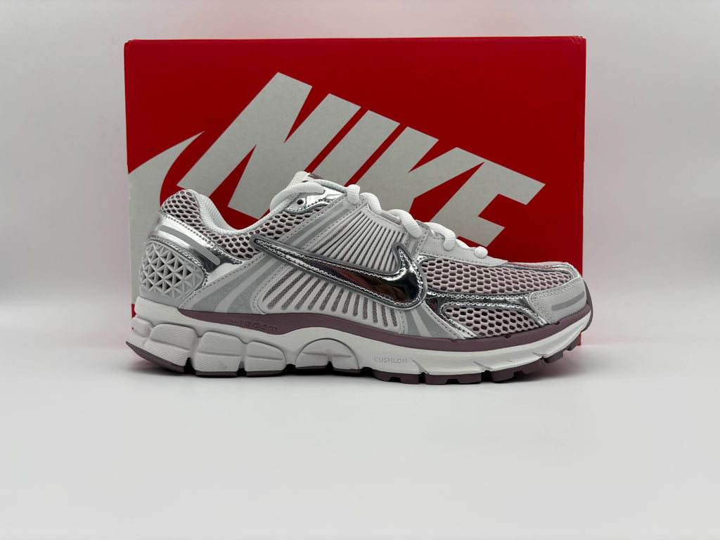 Side view of Nike Zoom Vomero 5 Vast Grey Metallic Silver running shoes with responsive Zoom Air cushioning, breathable mesh and synthetic upper, and durable rubber outsole for comfort and performance
